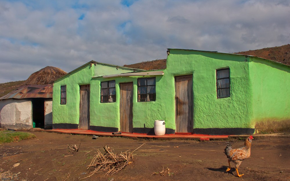 Serendipity is a great asset that makes many photographs more than what they would have been. In this instance the chicken's decision to run across the shot I was framing meant it became one of my favourite homesteads forever. Photographed in the Natal Midlands on 13 July 2014.